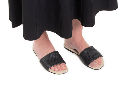 Black woven leather slides